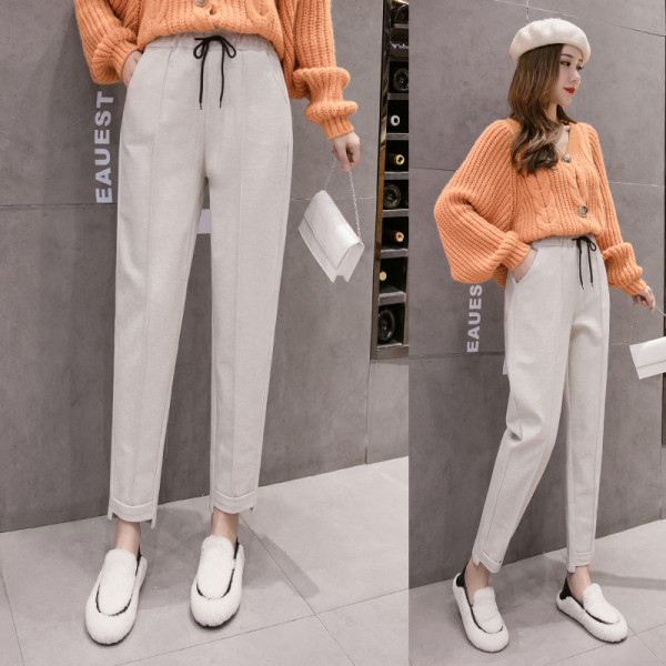 Divatos női nadrág zsebekkel fehér és fekete színben