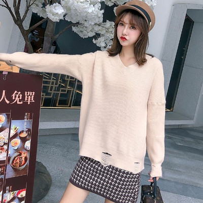 Új modell női pulóver spitz nyakkivágással, szakadt motívumokkal