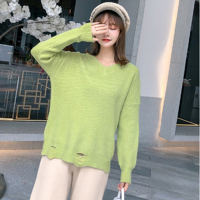 Új modell női pulóver spitz nyakkivágással, szakadt motívumokkal