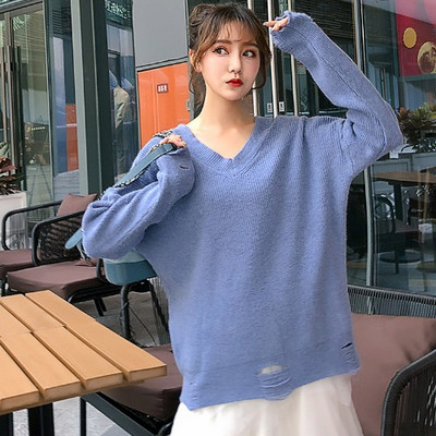 Új modell női pulóver spitz nyakkivágással, szakadt motívumokkal