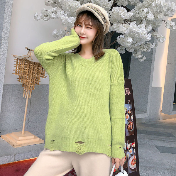 Új modell női pulóver spitz nyakkivágással, szakadt motívumokkal