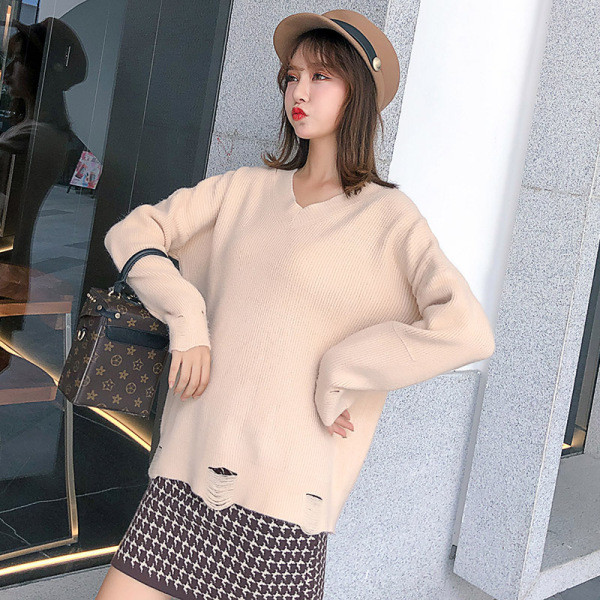 Új modell női pulóver spitz nyakkivágással, szakadt motívumokkal