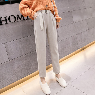 Női alkalmi nadrág fekete és bézs színű övvel