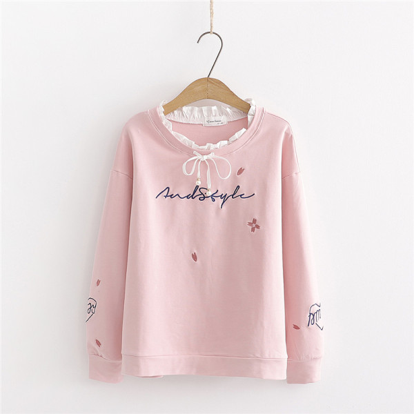 Modern női blúz fehér és rózsaszín szalaggal