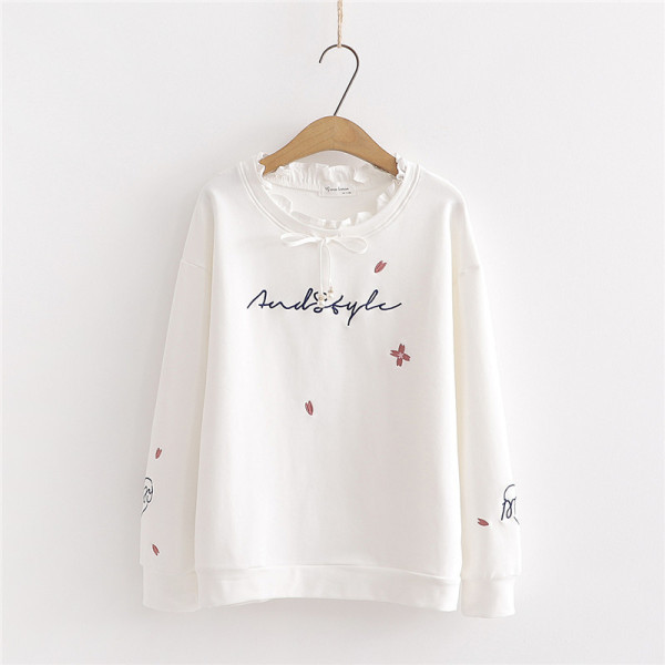 Modern női blúz fehér és rózsaszín szalaggal