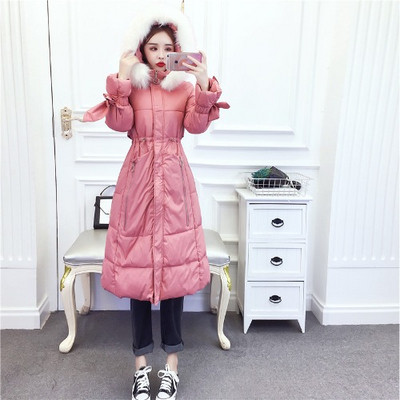 Hosszú téli kabát cipzárral és kapucnival