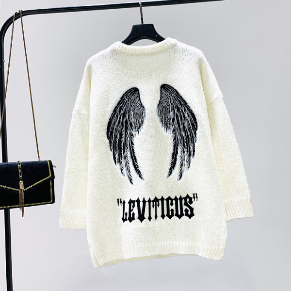 Hosszú pulóver fehér és fekete hímzéssel