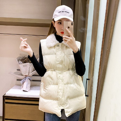 Μακρύ χειμωνιάτικο γιλέκο με κοδόνια στη μέση και γούνινο γιακά