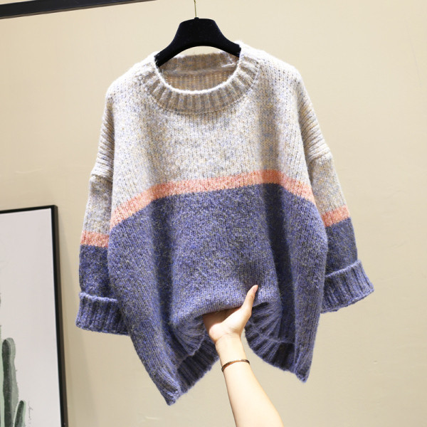 Női téli pulóver kerek nyakkivágással, aszimmetrikus mintával