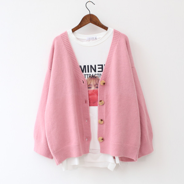 Női kardigán gombokkal és spitz nyakkivágással