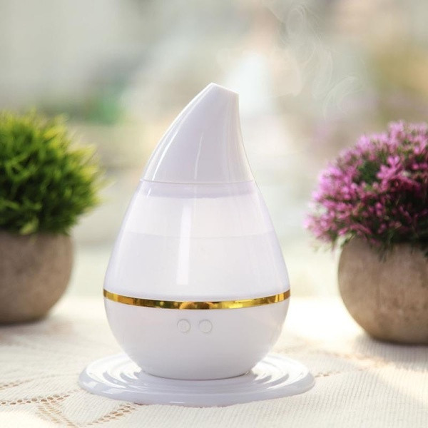 Дифузер за етерични масла и арома терапия  с LED светлини в седем цвята 