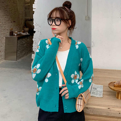 Σύντομη γυναικεία  ζακέτα  σε μπλε χρώμα με χρωματιστώ μοτίβο