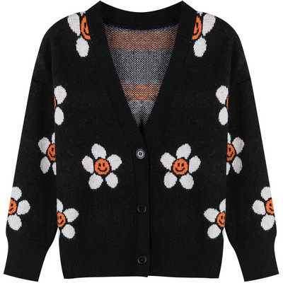 Σύντομη γυναικεία  ζακέτα  σε μπλε χρώμα με χρωματιστώ μοτίβο