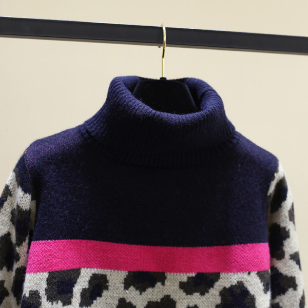 Γυναικείο κομψό πουλόβερ με ψηλό κολάρο 