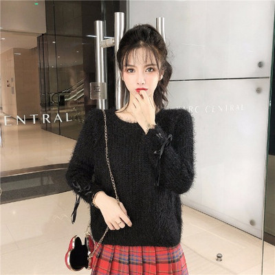 Női pehelypulóver, ujjain megkötős zöld és fekete színben