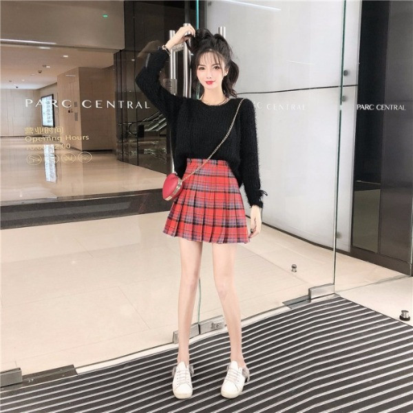 Női pehelypulóver, ujjain megkötős zöld és fekete színben