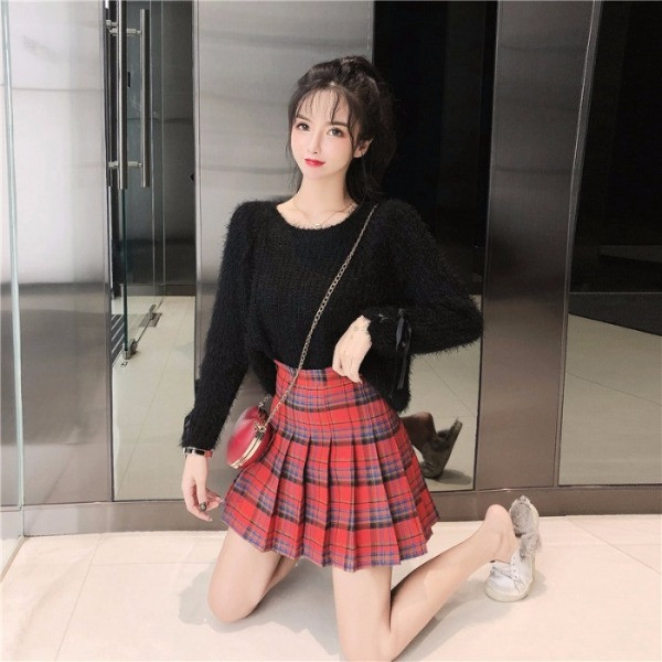 Női pehelypulóver, ujjain megkötős zöld és fekete színben