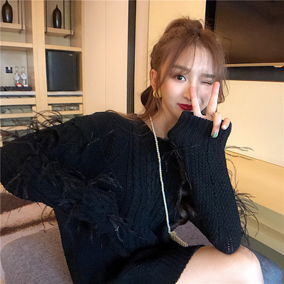 Μακρύ χειμερινό πουλόβερ  με κρόσσια στα μανίκια