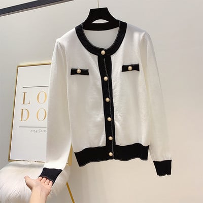 Μοντέρνα γυναικεία ζακέτα με κουμπιά σε λευκό και μαύρο χρώμα