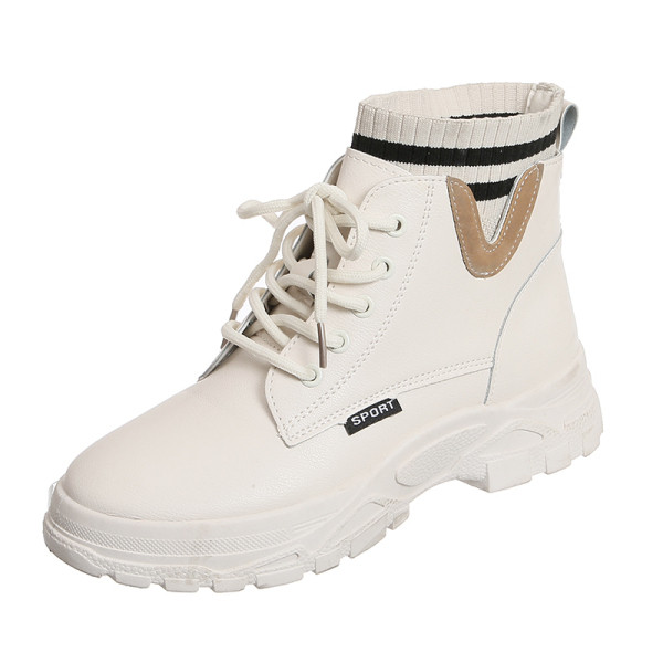 Modern női csizma fűzővel és lapos talppal, fekete-fehér színben