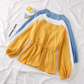 Modern női ing kerek nyakkivágással, gombokkal és megkötővel a derekán