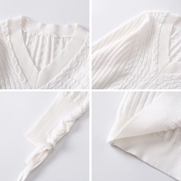 Modern női pulóver spitz nyakkivágással és megkötős ujjakkal, fehér színben