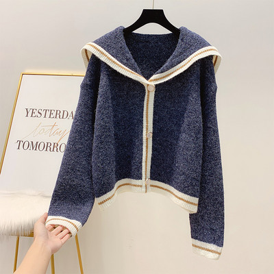 Széles modellű női kardigán kék-fehér gombokkal