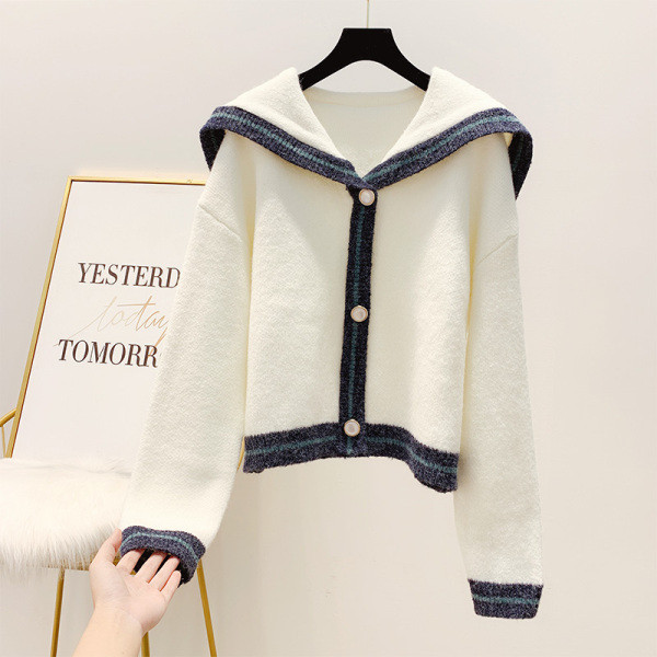 Széles modellű női kardigán kék-fehér gombokkal