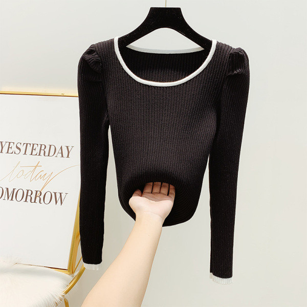 Vékony kötésből készült női pulóver puffos ujjakkal, fehér és fekete színben