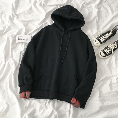 Női pulóver fekete, fehér és szürke színben kapucnival és nyakkendővel