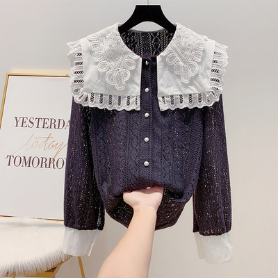 Női csipke ing fehér és fekete gombokkal