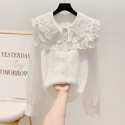 Női csipke ing fehér és fekete gombokkal
