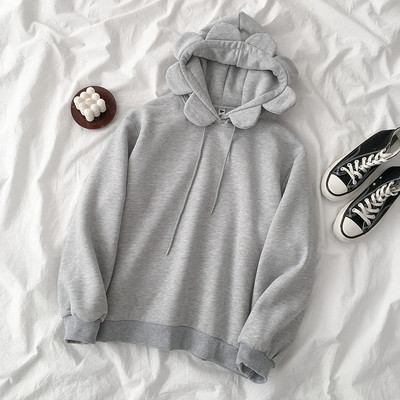 Szürke és sárga színű női pulóver kapucnival és nyakkendővel