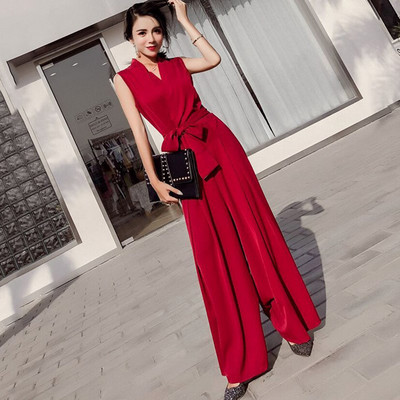 Μοντέρνα γυναικεία ολοσωμη φόρμα ε φαρδιές λωρίδες και ζώνη