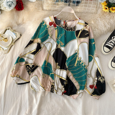 Modern rakott női blúz ovális nyakkivágással, színes mintával több színben