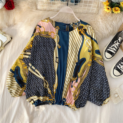 Modern rakott női blúz ovális nyakkivágással, színes mintával több színben