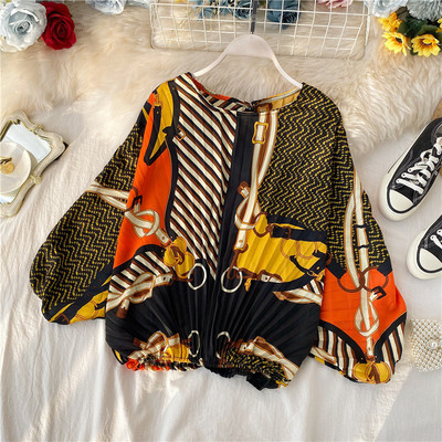 Modern rakott női blúz ovális nyakkivágással, színes mintával több színben