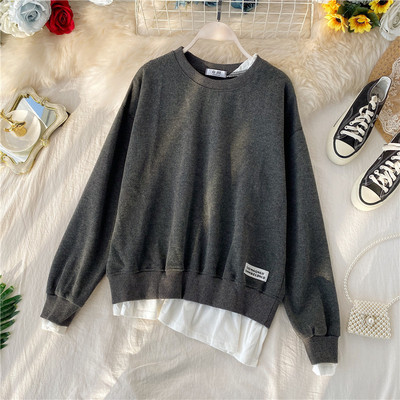 Μοντέρνο πουλόβερ με ωοειδές λαιμόκοκκο και ασύμμετρο μοτίβο με μακρύ μανίκι