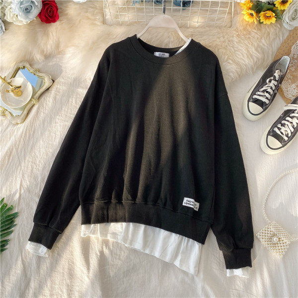 Μοντέρνο πουλόβερ  με ωοειδές λαιμόκοκκο και ασύμμετρο μοτίβο με μακρύ μανίκι