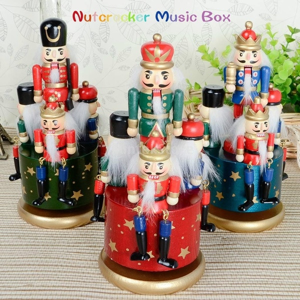 Decorative wooden wooden box with hazelnut crushers in red, blue and green