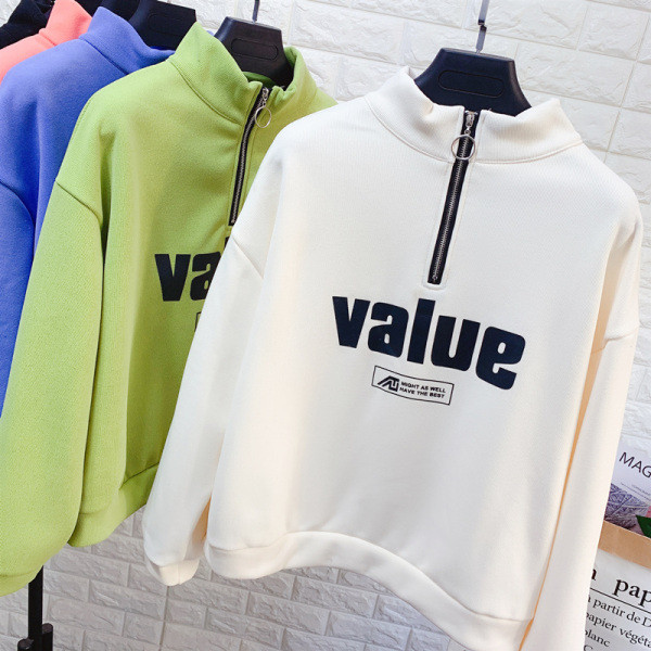 Női blúz pólógallérral, cipzárral és több színben nyomott mintával