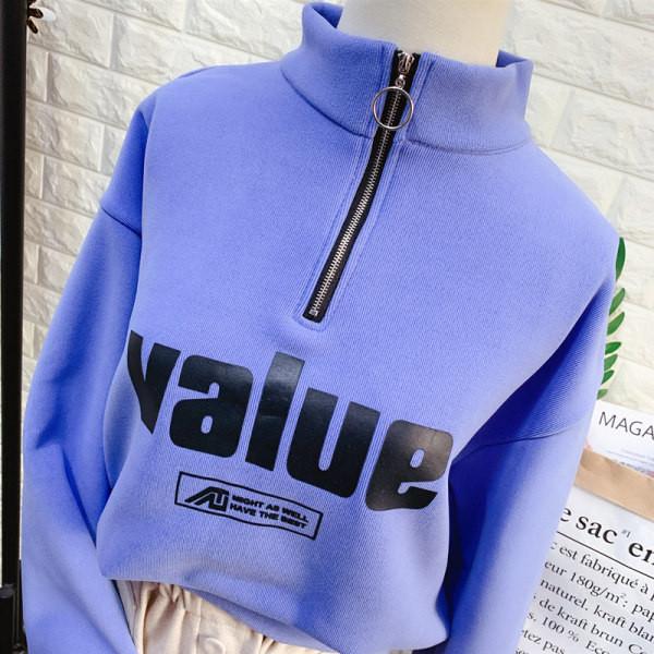 Női blúz pólógallérral, cipzárral és több színben nyomott mintával