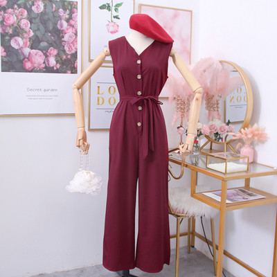 Női overál gombokkal és övvel zöld, sárga, fekete és bordó színben