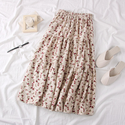 Modern női szabású szoknya virágos motívumokkal, bézs és rózsaszín színben