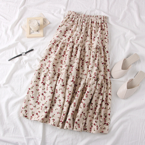 Modern női szabású szoknya virágos motívumokkal, bézs és rózsaszín színben