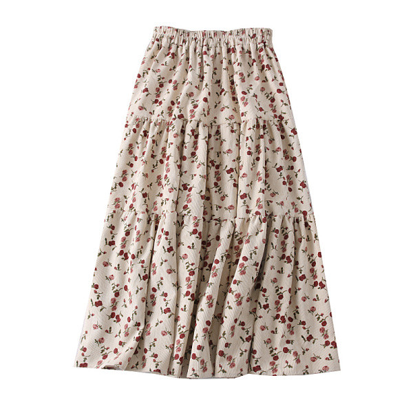 Modern női szabású szoknya virágos motívumokkal, bézs és rózsaszín színben