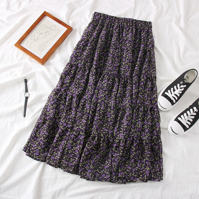 Lezser női szabású szoknya virágos motívumokkal, bézs, kék és lila színekben