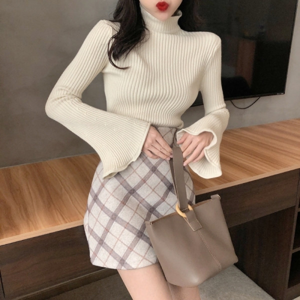 Női kötött pulóver lótusz ujjal és magas gallérral több színben