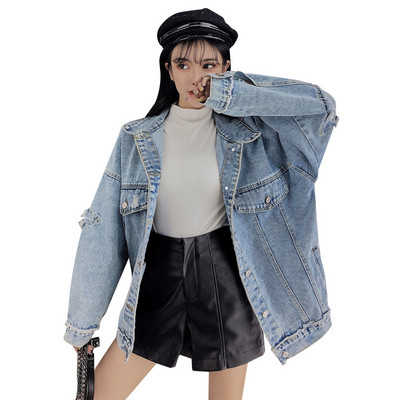 Széles farmerdzseki, kék színben szakadt motívumokkal