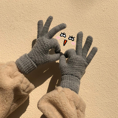 Women`s winter knitted gloves in gray, beige, brown and black
